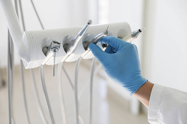 Professional Tooth Extraction technician working in Versailles, KY